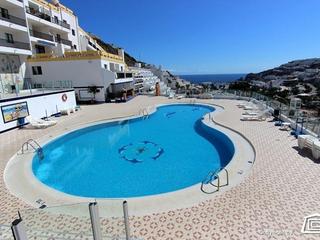 Schwimmbad : Apartment zu kaufen in Puerto Feliz,  Puerto Rico, Gran Canaria  mit Meerblick : Ref 05823-CA